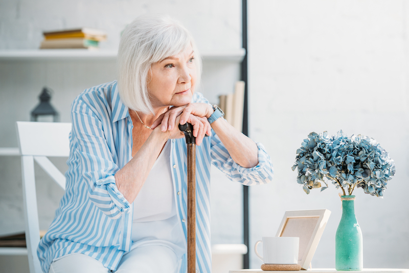 senior alone looking far away 